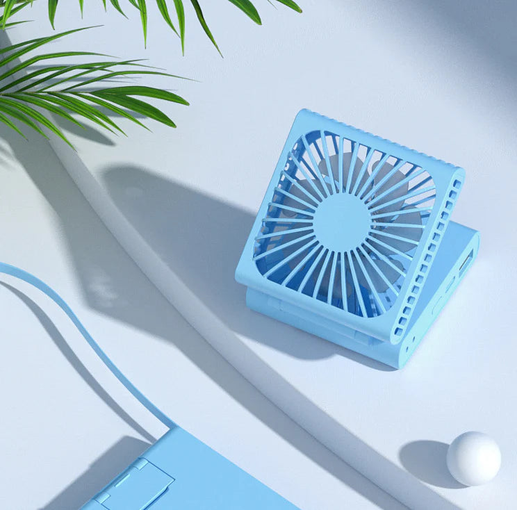 Compact portable USB power bank with built-in cooling fan, perfect for on-the-go use by British consumers