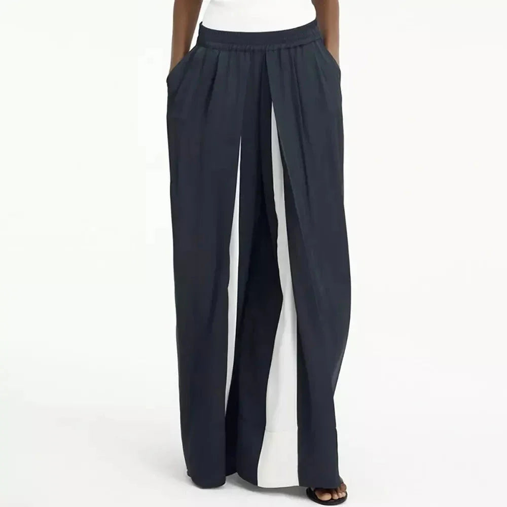 Chic navy high-waist wide-leg trousers with elegant patchwork design, offering timeless sophistication and modern style.