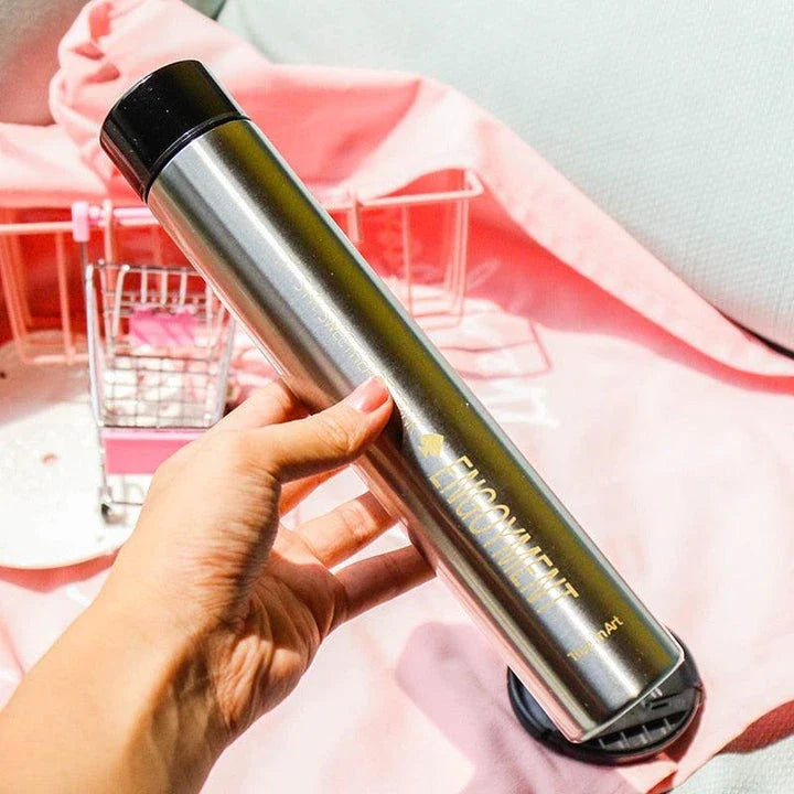 Elegant and slim stainless steel travel thermos in gold colour, with a straight cup design for comfortable one-handed use