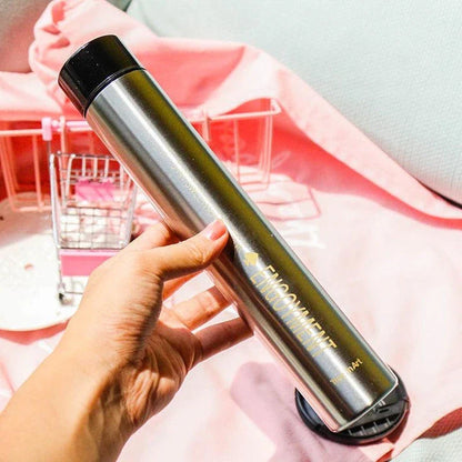 Elegant and slim stainless steel travel thermos in gold colour, with a straight cup design for comfortable one-handed use
