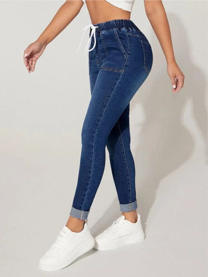 Premium navy blue drawstring waist skinny jeans with a vintage-inspired stone-washed finish