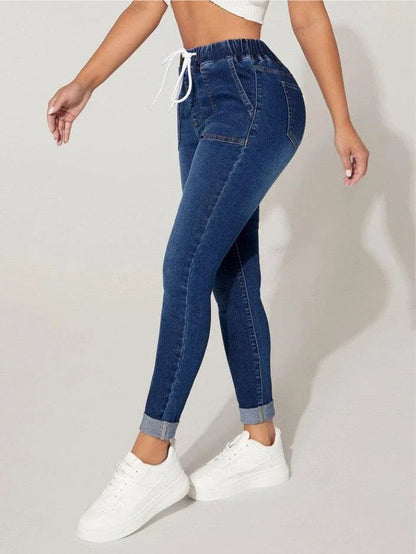 Premium navy blue drawstring waist skinny jeans with a vintage-inspired stone-washed finish