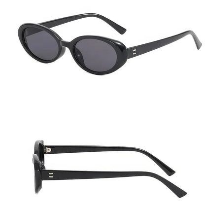 Oval-shaped women's sunglasses in a white and grey colour, offering UV protection and a stylish, retro-inspired design.