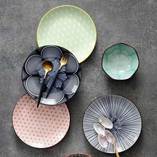 Elegant ceramic plates with vibrant, whimsical prints in a variety of enchanting designs
