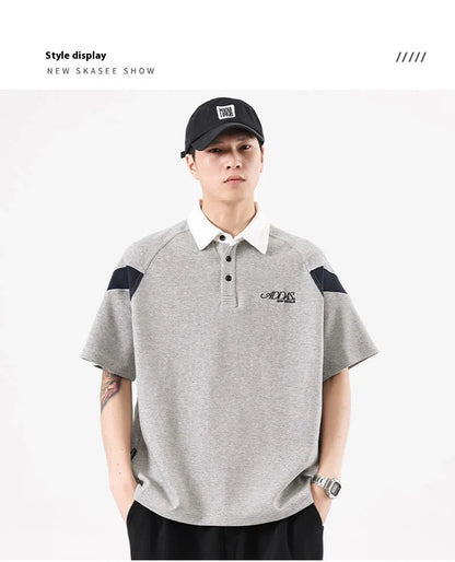 Melange grey polo shirt with contrast stitching, designed and made in Britain for comfortable summer wear