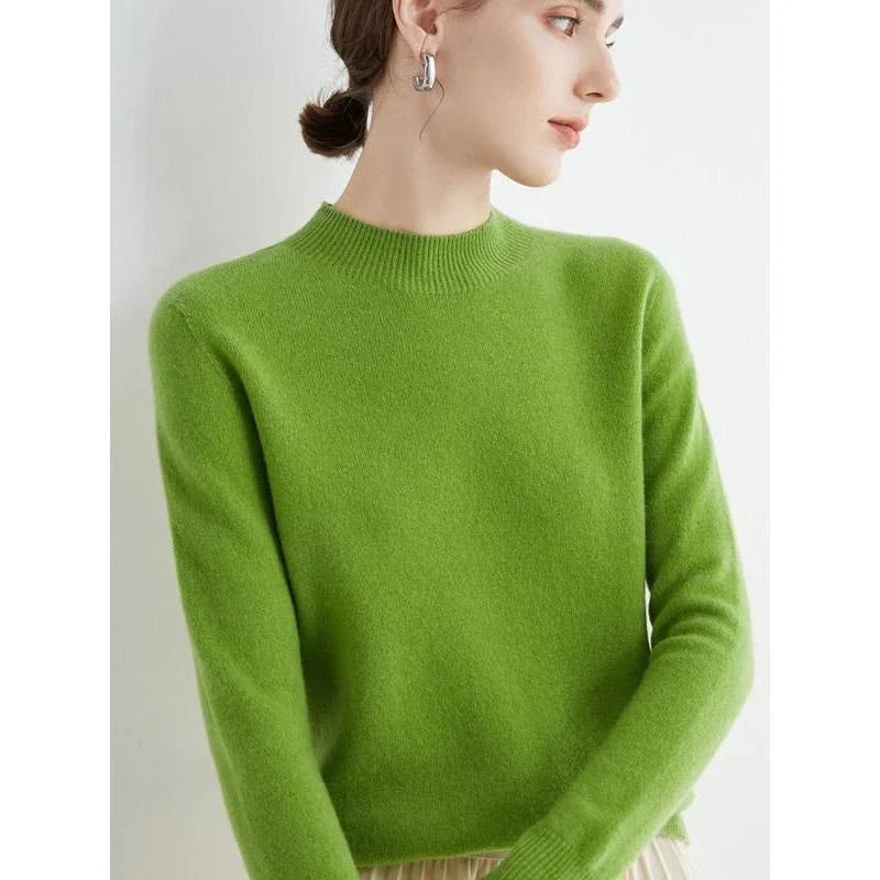 A woman wearing a luxurious Merino wool mock-neck jumper in a stylish autumnal outfit