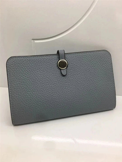 Premium cowhide leather wallet with luxurious lychee pattern design, featuring multiple compartments for secure storage and organisation.