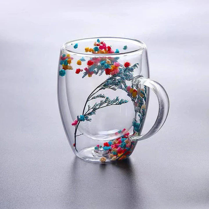 Elegant double-walled glass tea mug with captivating floral display, perfect for hot and cold beverages