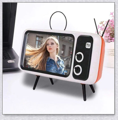 Retro TV-inspired phone stand with built-in Bluetooth speaker for hands-free entertainment and music playback