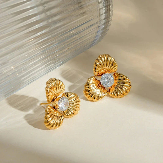 Elegant 18K gold-plated stainless steel flower stud earrings with sparkling zircon inlays, designed for timeless style and all-day comfort.