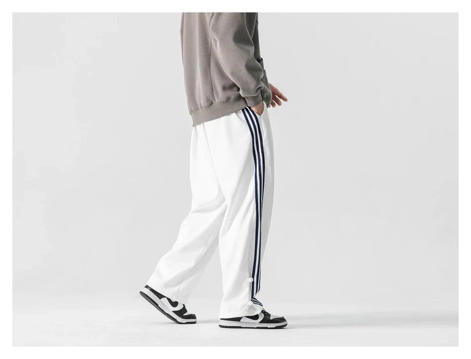 Stylish striped sports trousers in a relaxed, mid-waist design for versatile leisure and athletic wear