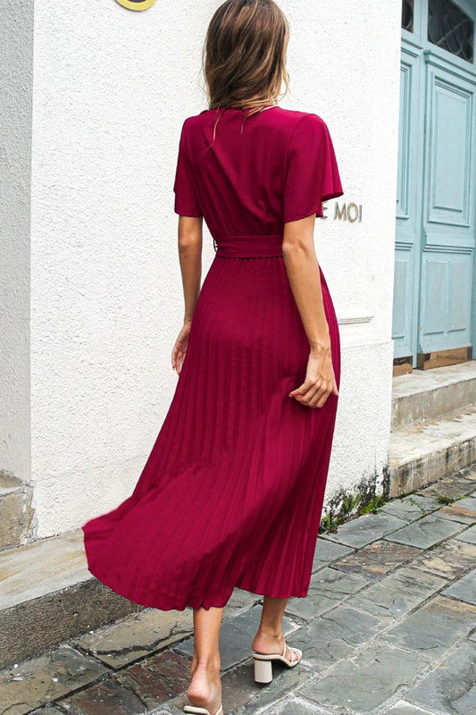 Elegant black midi dress with belted waist and flutter sleeves, perfect for any occasion
