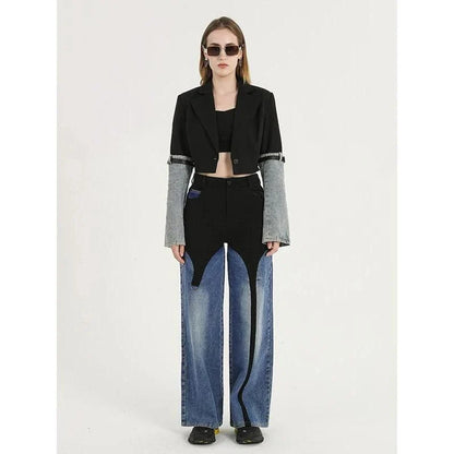 A stylish denim patchwork blazer with a notched collar and single-button closure, designed for the modern British woman