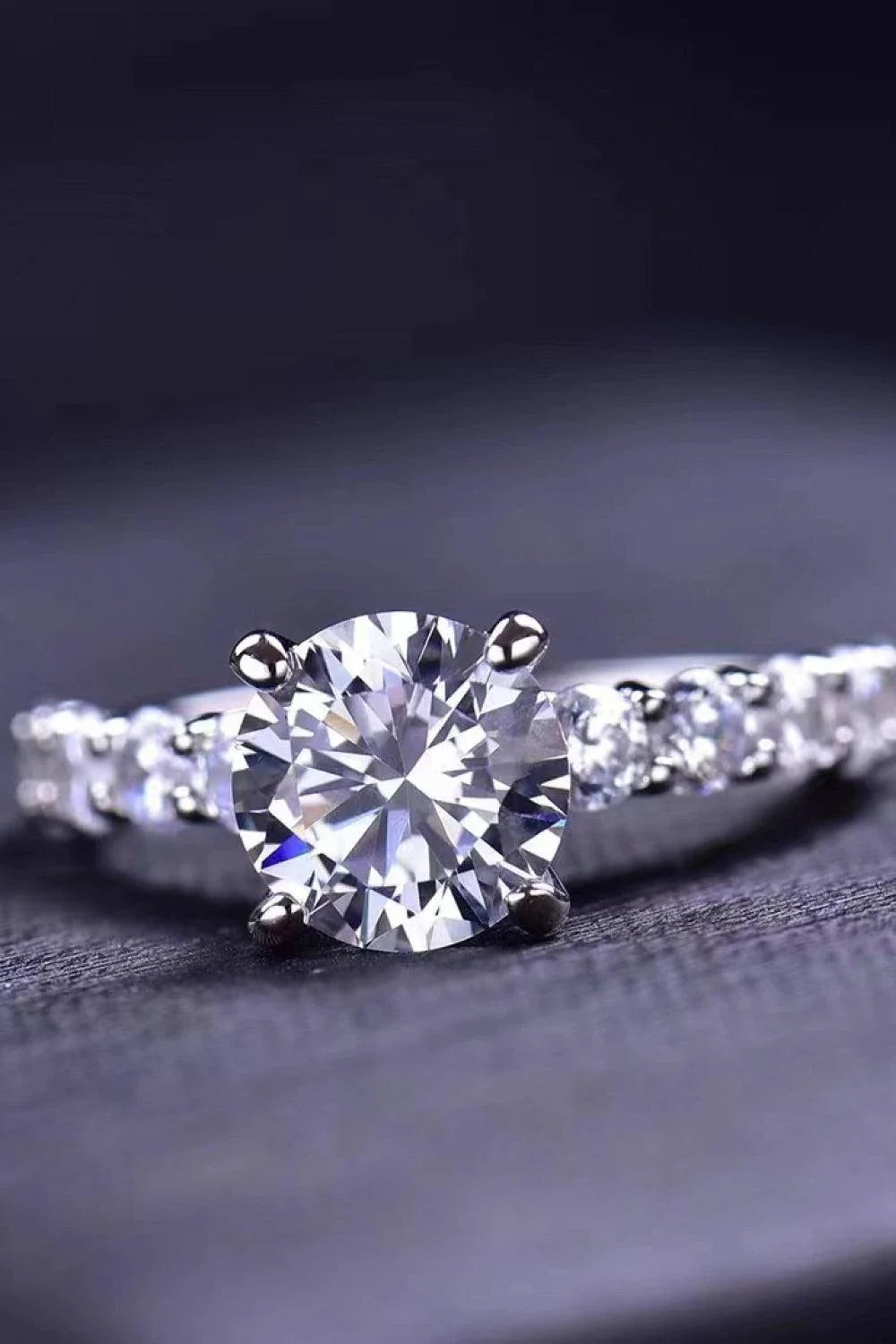 Exquisite 2-carat moissanite solitaire ring in 925 sterling silver, featuring a mesmerising centre stone and delicate metalwork for a modern, minimalist design.