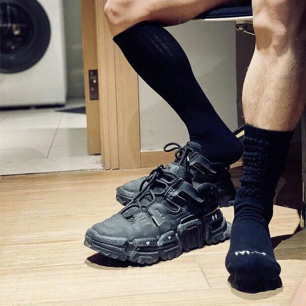 Premium men's breathable terry socks in various solid colours, offering superior moisture-wicking and comfort