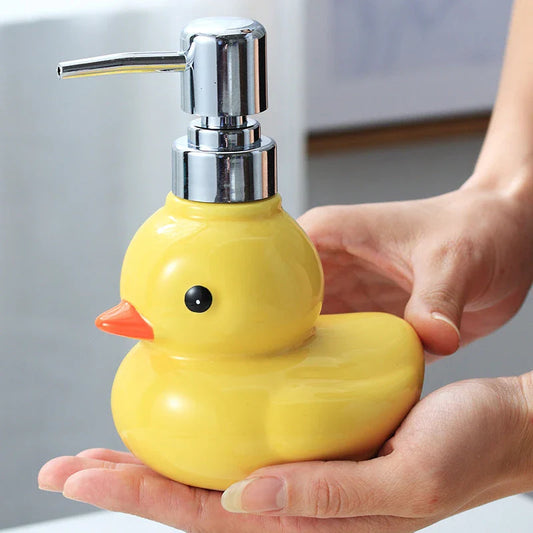 Charming yellow duck ceramic soap dispenser with matching soap dish, perfect for adding a playful touch to your bathroom or kitchen.