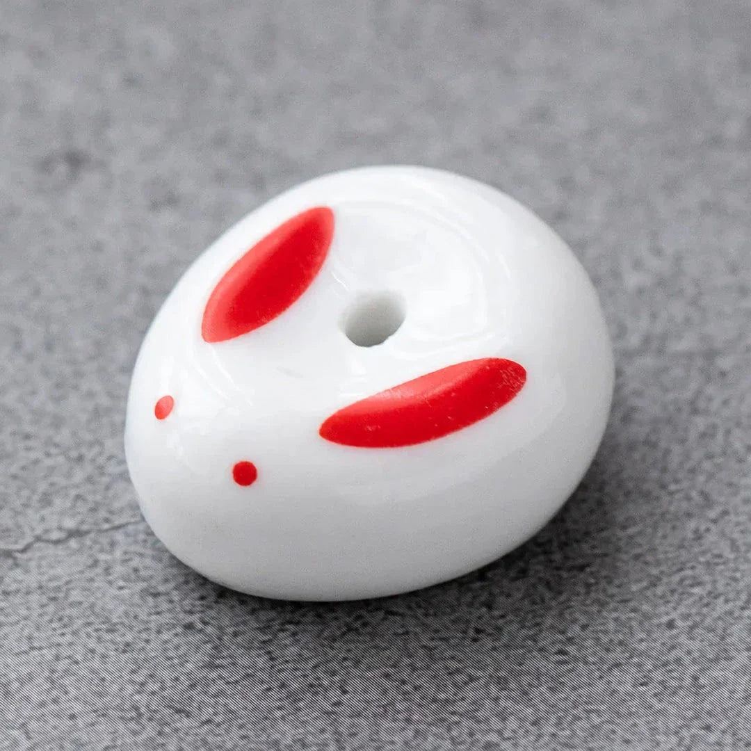 Charming Japanese-style ceramic incense holder with a playful rabbit and kitten design, perfect for creating a relaxing atmosphere in any room.