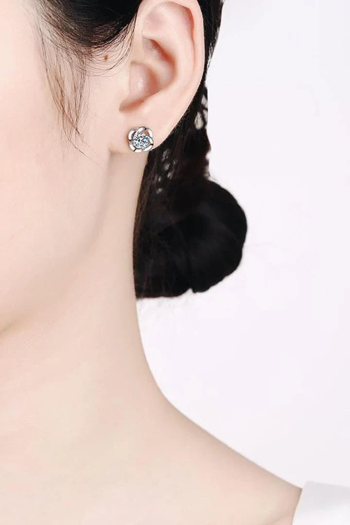 Pair of rhodium-plated moissanite stud earrings with a sleek, minimalist design