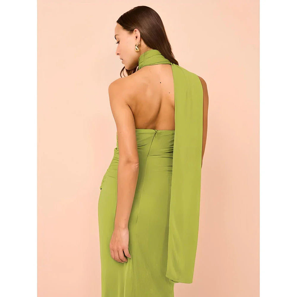Elegant halter backless ankle-length bodycon dress in a solid colour, designed to flatter the figure and create a sophisticated, eye-catching look for formal events.