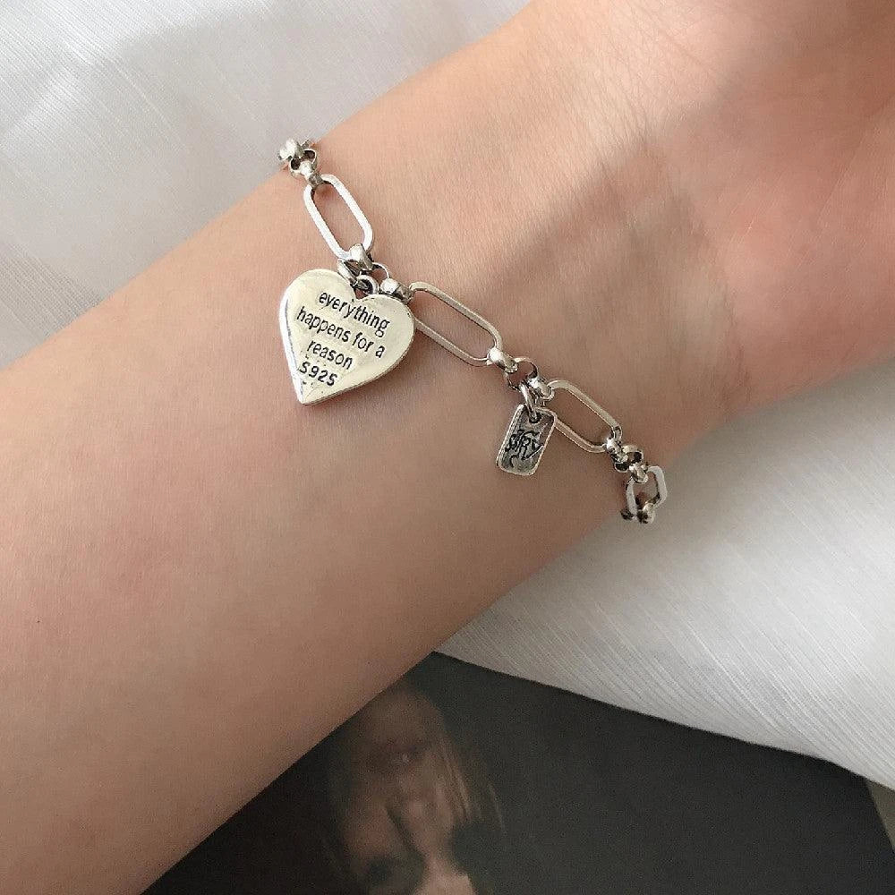 Elegant sterling silver bracelet with a delicate heart charm, a timeless accessory for the modern British woman.