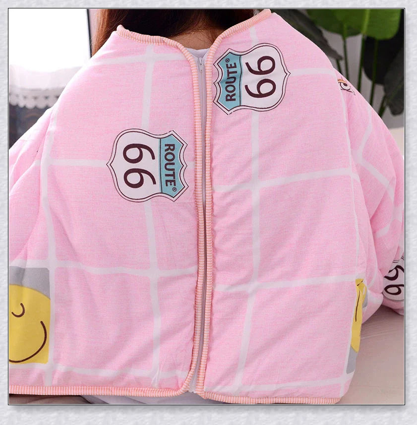 A cosy, wearable quilt with sleeves in a variety of colourful designs, perfect for staying warm and comfortable during the winter months.