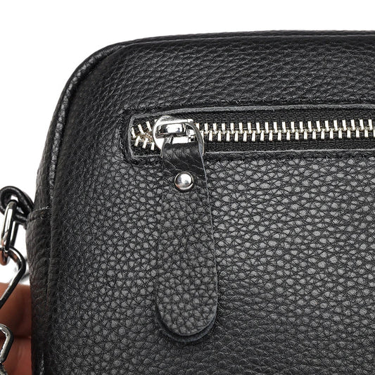 Stylish leather crossbody bag with embroidered strap in various colours