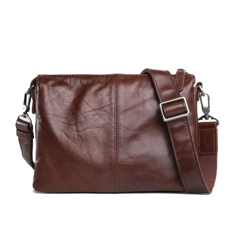 Premium cowhide leather crossbody bag with versatile internal compartments, perfect for the modern British fashionista
