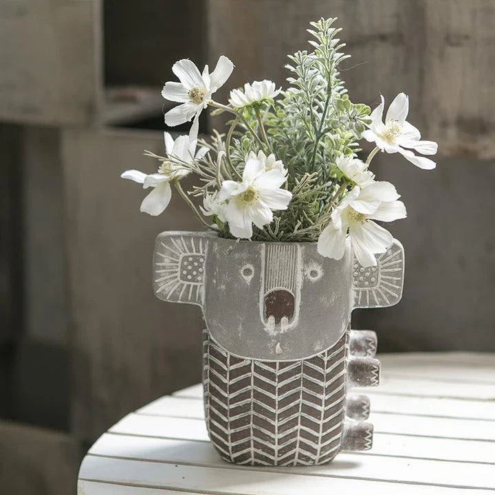 Charming retro koala-shaped cement planter for succulents and small flowers, available in two sizes