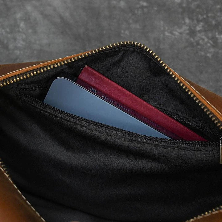 Premium leather clutch bag with multiple interior pockets, designed for the sophisticated British gentleman