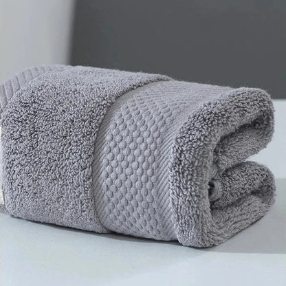 Premium 100% cotton face towel in blue, featuring a soft and absorbent design for daily facial cleansing and bathing