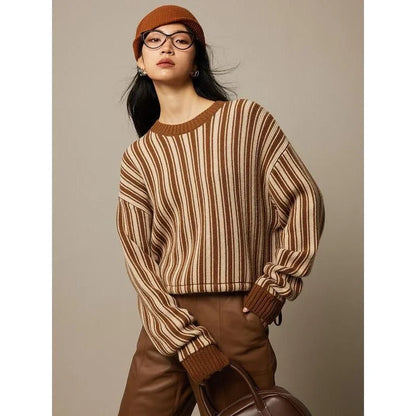 A chic striped wool-blend jumper in black, featuring an elegant O-neck design and a relaxed, flattering fit