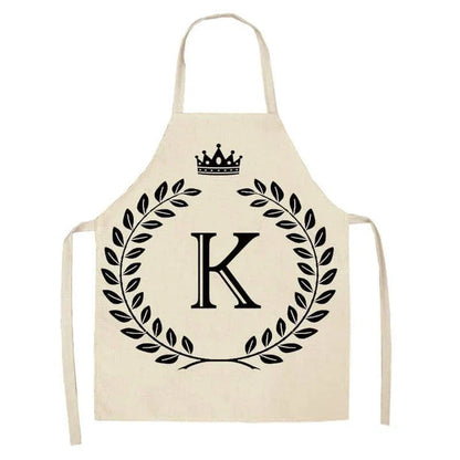 A high-quality kitchen apron featuring a charming crown and letter print design in a premium cotton and linen blend fabric.