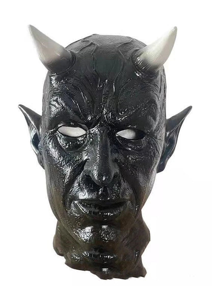 A close-up view of a black latex mask with twisted, menacing horns, creating a fearsome demonic appearance for Halloween costumes and parties.