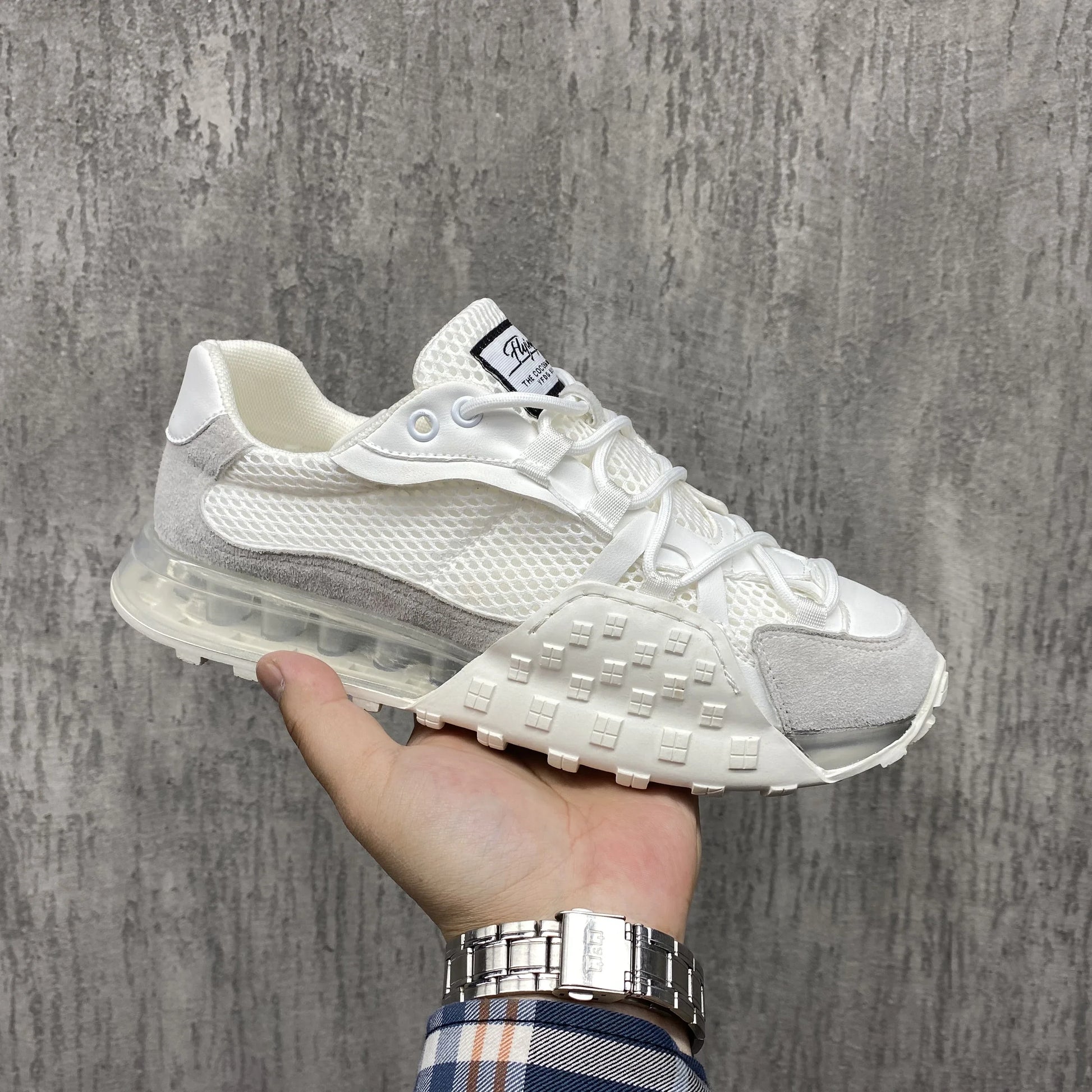 Premium leather lace-up trainers in white with breathable inner lining and slip-resistant rubber sole