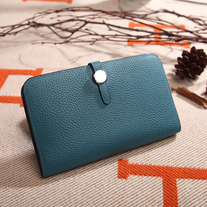 Premium cowhide leather wallet with luxurious lychee pattern design, featuring multiple compartments for secure storage and organisation.