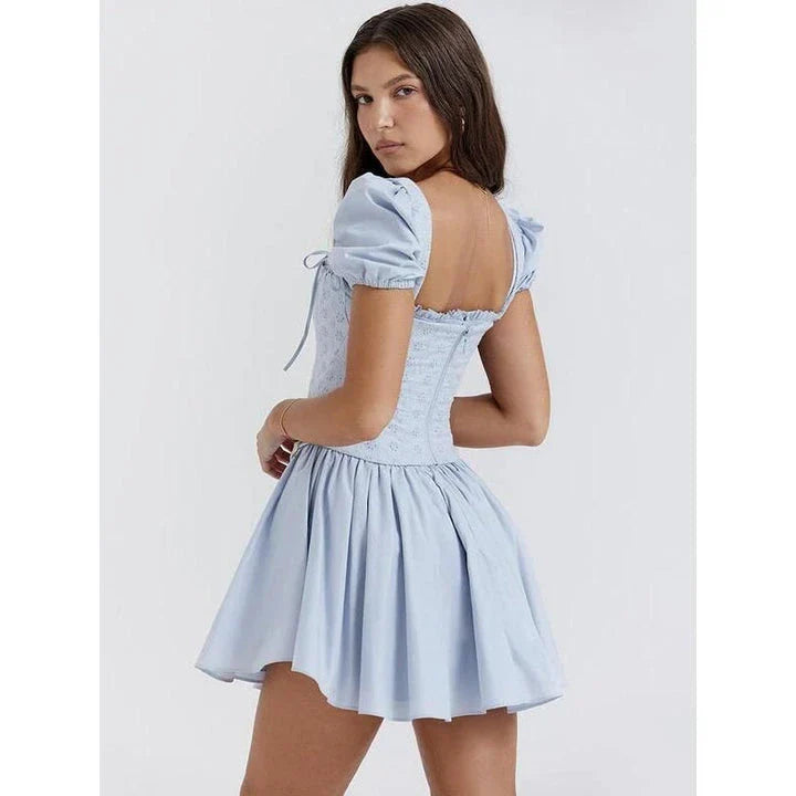 Elegant puff sleeve mini dress with square collar, backless design, and A-line silhouette for modern British women