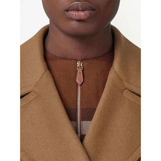 A stylish mid-length double-breasted overcoat made from a warm, durable wool and polyester blend fabric