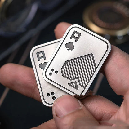 Premium British-made fingertip peg-top decompression toy in silver, copper, and skull designs