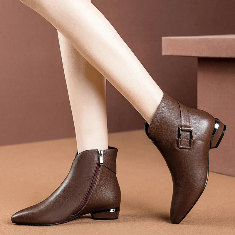 Premium low-heel short-tube ladies fashion boots in black and dark brown colours, featuring a sleek pointed toe and subtly profiled heel design