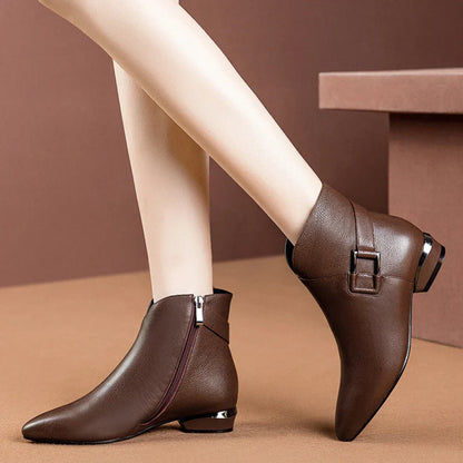 Premium low-heel short-tube ladies fashion boots in black and dark brown colours, featuring a sleek pointed toe and subtly profiled heel design