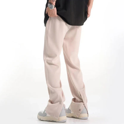 Sophisticated retro-style casual suit trousers in black and apricot colours, featuring a sleek straight-leg silhouette and distinctive back slit