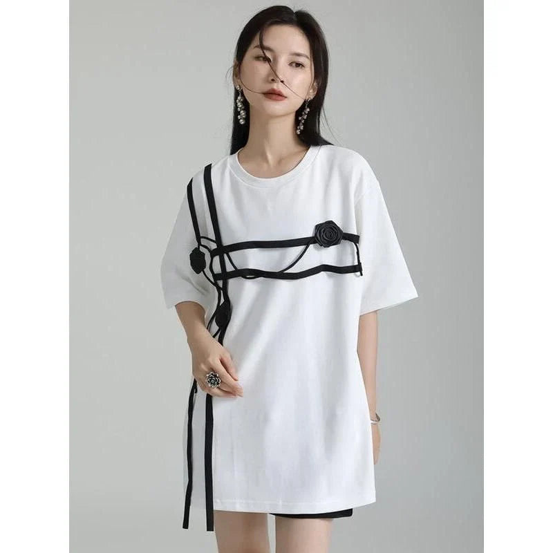 A stylish black and white floral half-sleeve casual t-shirt with a classic round neckline, perfect for everyday wear.