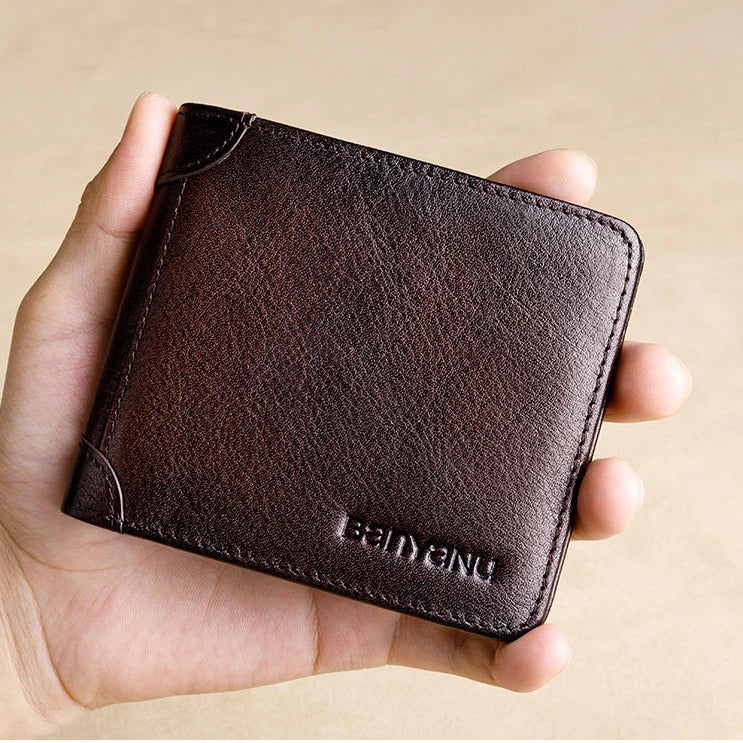 Premium men's short leather wallet with tri-fold design, made from top-grain cowhide leather for exceptional quality and style.