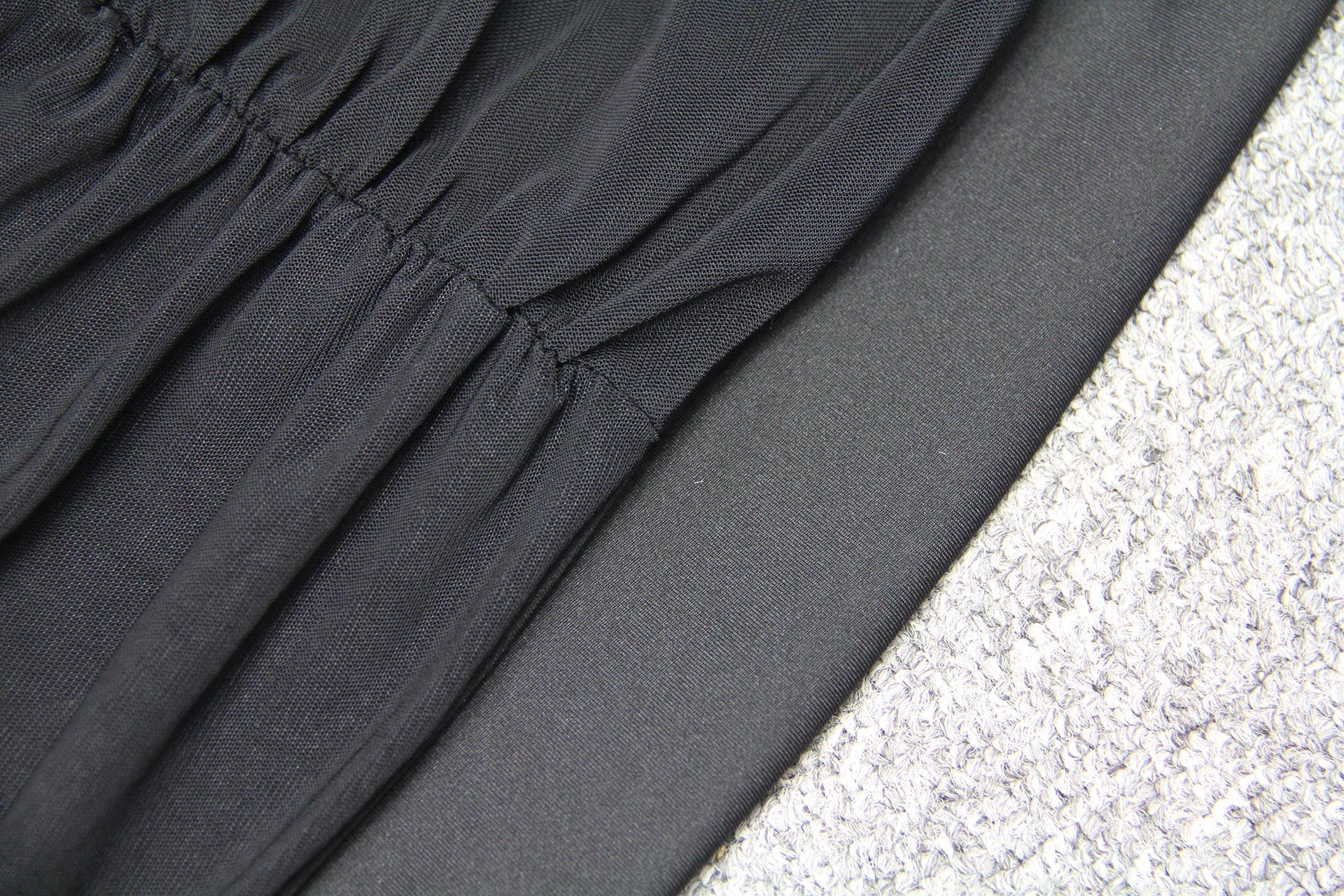 Elegant puff sleeve mesh dress with a flattering short, irregular skirt in white and black colours