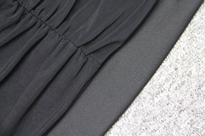 Elegant puff sleeve mesh dress with a flattering short, irregular skirt in white and black colours