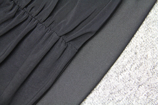 Elegant puff sleeve mesh dress with a flattering short, irregular skirt in white and black colours