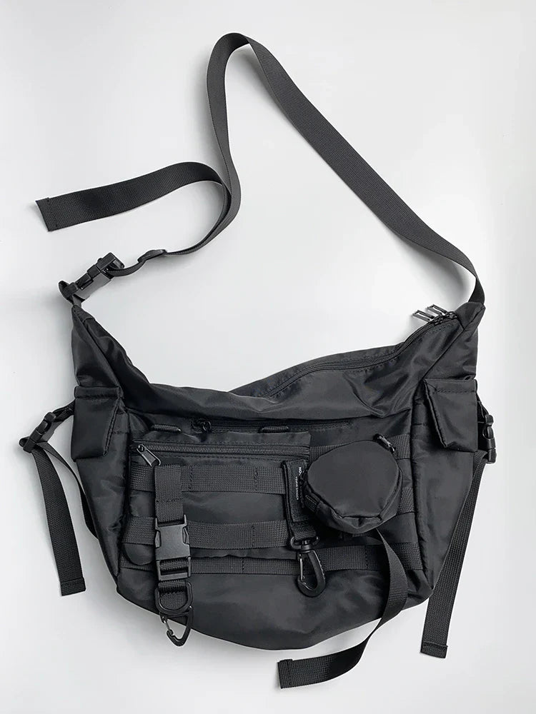 Premium nylon crossbody bag in black with adjustable strap and internal pockets for everyday use