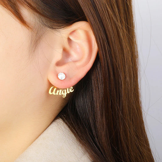 Customised name earrings in various shapes and finishes, including gold and platinum stars, hearts, squares, and rounds