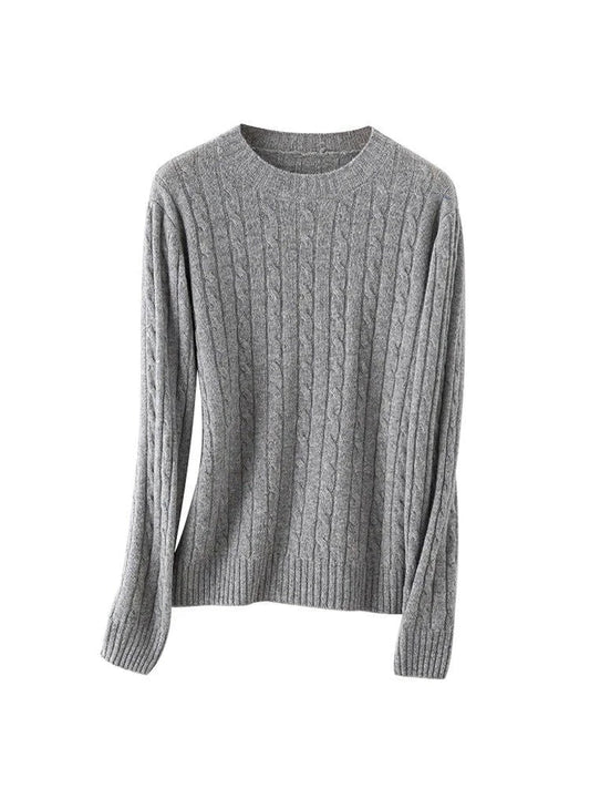 A luxurious 100% British wool cable knit jumper in a rich camel colour, perfect for keeping warm during the UK's chilly winters.