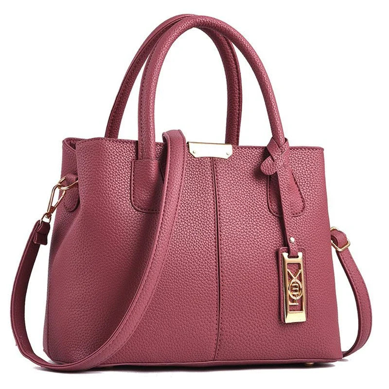 A stylish one-shoulder tote bag in various colours, made of premium polyester with an adjustable strap and spacious interior for the modern professional woman.